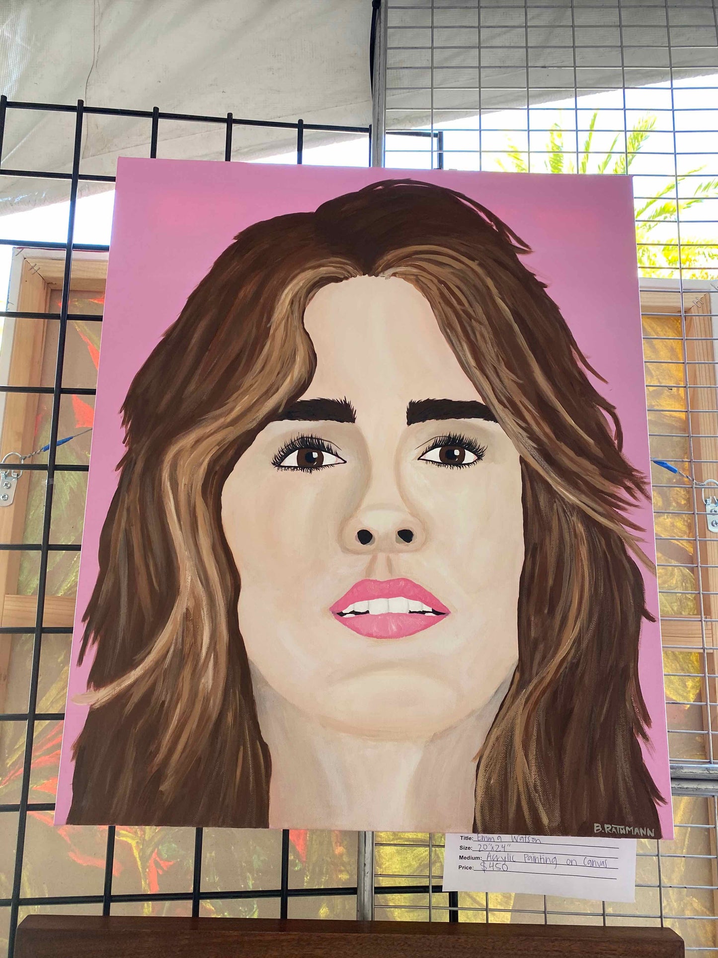 Emma Watson Portrait Painting is a portrait of Emma Watson. This is a portrait rendition of the Emma Watson will add a fun and bold aesthetic with your decor. This piece was featured at the 2022 ArtsQuest Festival in Sandestin, Florida.