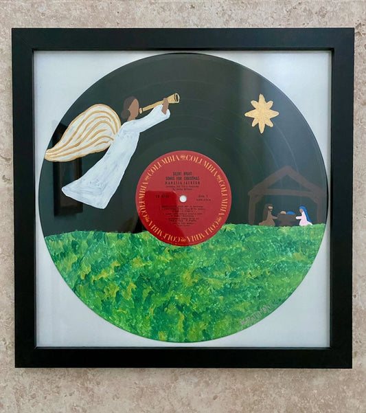 Silent Night Record is an acrylic painting of the Wonderful Holy Night of the birth of Jesus! This original painting is perfect for any space. This work was done on a repurposed vinyl record bought at a local thrift store. This was inspired by the music listed on the vinyl album. The frame is included with purchase.