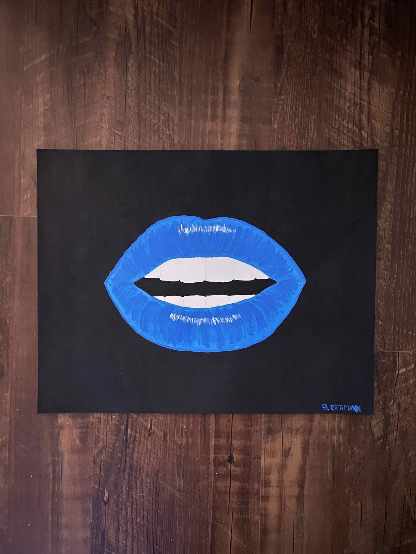 This is an original acrylic painting on heavy paper. The bright blue lips are centered on a black background.