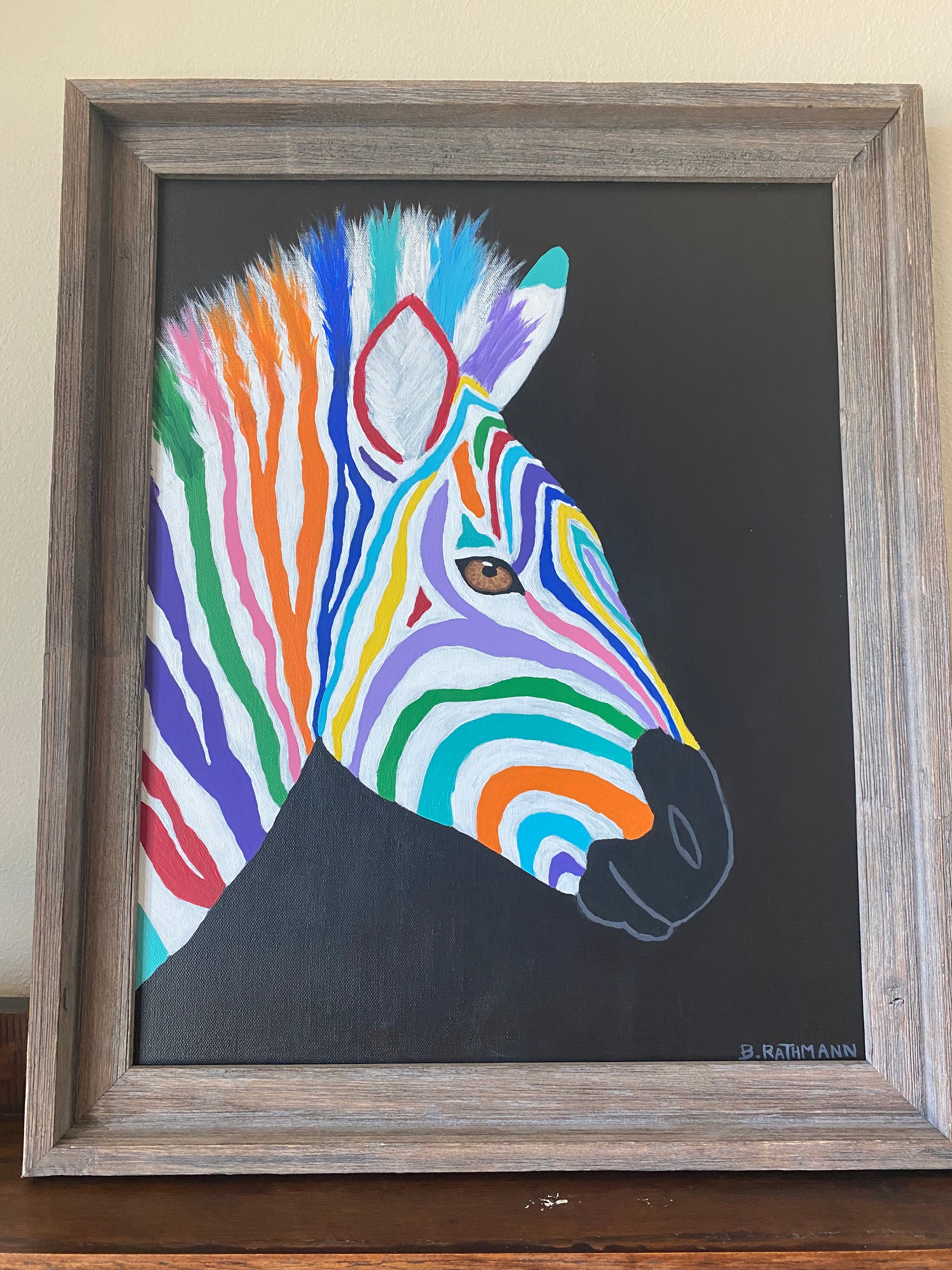 You Are the Only You Painting is a colorful rainbow zebra painting. This is an abstract rendition of a Zebra that will add a fun and bold aesthetic with your decor. This piece was featured at the 2022 ArtsQuest Festival in Sandestin, Florida. This piece includes the frame with purchase. Measurement: 16"x20"
