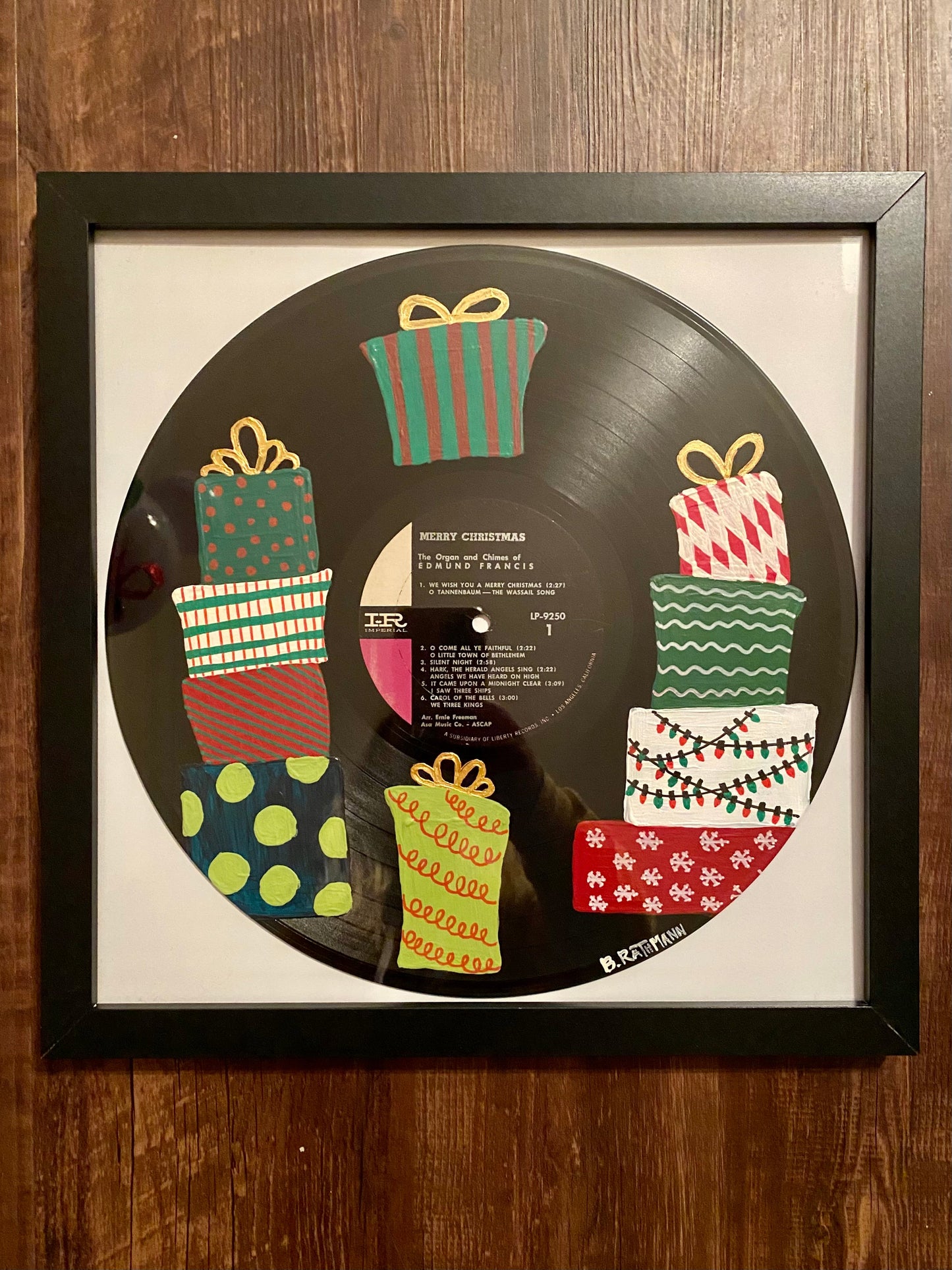 We Wish You a Merry Christmas  Record is an acrylic painting of a dreamy winter wonderland with a snowman and a Christmas tree! This original painting is perfect for any space. This work was done on a repurposed vinyl record bought at a local thrift store. This was inspired by the music listed on the vinyl album. The frame is included with purchase.