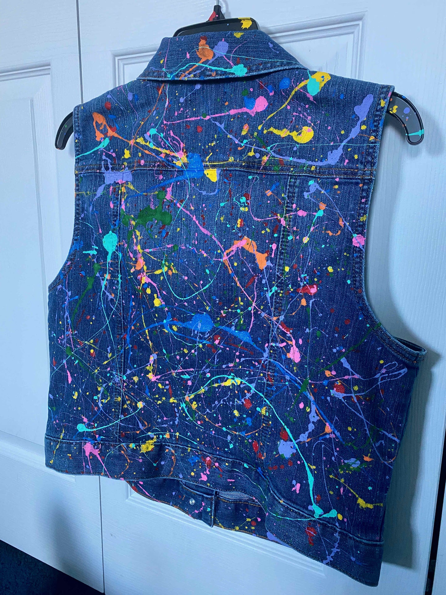 This is a one of kind custom splatter paint denim vest that is meant to make a statement. This vest was hand painted and carefully designed. 
